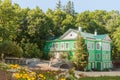 Idyllic green home in the garden in sunny summer day