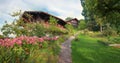 Idyllic hiking trail to lookout point Buel, Krattigen. rural farmstead with flower garden