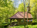 A idyllic house in the green woodland, idyllic architecture of wooden raw material.