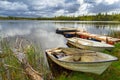 Idyllic lake scenery with boats in cloudy day