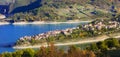 Idyllic lake scenery - Lago Turano and beautiful village Cole di Tora in Rieti province, Italy