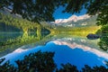 Framed Lake Tovel reflection symmetry in Trentino-Alto Adige, Dolomites, Italy