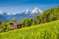 Idyllic landscape in the Alps with traditional mountain lodge Royalty Free Stock Photo