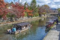 Idyllic landscape of Hachiman-bori canal in Omihachiman, Japan in autumn season