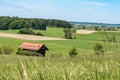 Idyllic landscape with hut in front of blue sky in Germany Bavaria Royalty Free Stock Photo