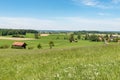 Idyllic landscape with hut in front of blue sky in Germany Bavaria Royalty Free Stock Photo