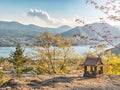 Idyllic landscape in the Japan with traditional wooden toy house and beautiful lake with mountains at the background Royalty Free Stock Photo