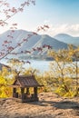 Idyllic landscape in the Japan with traditional wooden toy house and beautiful lake with mountains at the background Royalty Free Stock Photo