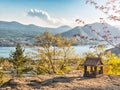 Idyllic landscape in the Japan with traditional wooden toy house and beautiful lake with mountains at the background Royalty Free Stock Photo