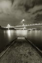 Idyllic landscape of Jetty and bridge of Hong Kong city at night in monochrome Royalty Free Stock Photo