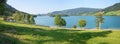 Idyllic landscape lake Schliersee, green pasture at the lake shore, tourist destination bavaria