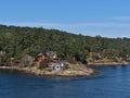 Idyllic landscape with residential houses on the rocky coast of Galiano Island, Strait of Georgia, Canada in autumn.