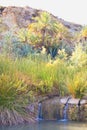 Idyllic landscape with a river that falls into a small reservoir