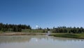 Idyllic landscape with a small lake surrounded with a volcanic vent next to the shoreline