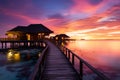 Idyllic Maldives sunset, overwater villas, sandy beach a travel daydream