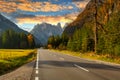 Idyllic mountain road through the Dolomites at sunset. Italy Royalty Free Stock Photo