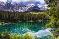 Idyllic nature scenery- turquoise mountain lake Carezza surrounded by Dolomites, Italy