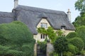 Idyllic old english house with topiary tree garden Royalty Free Stock Photo