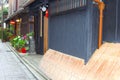 Idyllic old street wooden houses flowers, Gion, Kyoto, Japan Royalty Free Stock Photo