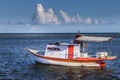 Idyllic Porto Seguro Beach with lonely fishermen trawler boat, BAHIA, Brazil