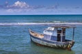 Idyllic Porto Seguro Beach with lonely fishermen trawler boat, BAHIA, Brazil