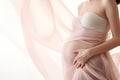 Idyllic Portrait of Pregnant Woman Wearing Chiffon Gown