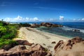 Tropical beach with granitic rocks and blue water