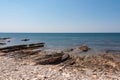 Idyllic rocky beach in tourist coastal town Medulin, Istria peninsula, Croatia, Europe. Panoramic view of rugged coastline Royalty Free Stock Photo