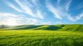 Idyllic rolling green hills under a vibrant sunrise with wispy clouds.