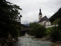 Idyllic rural alpine mountain chapel church St Sebastian at Ramsauer Ache in Ramsau Berchtesgaden Upper Bavaria Germany Royalty Free Stock Photo