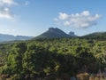 Idyllic rural landscape with View of limestone mountain Monte Oseli, green forest, trees and hills in region Ogliastra