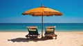 Idyllic Sandy Beach Setup With Deck Chairs Under a Straw Umbrella Overlooking Serene Ocean Royalty Free Stock Photo