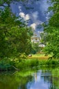 Idyllic scene in the palace garden of Sanssouci with trees and water on a sunny day with a view to the Chinese tea house Royalty Free Stock Photo