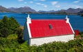 Idyllic scene of a quaint cottage situated lakeside in the Scottish Highlands