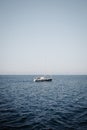 Idyllic scene of a sailboat gliding across the open ocean