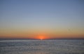 Idyllic scene of sunrise, red sky and blue sea