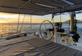 Idyllic scenery glowing sun down Ocean calm water view from catamaran flybridge open deck Royalty Free Stock Photo