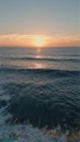 Idyllic sea sunset shining in deep blue ocean water aerial view. Waves foaming Royalty Free Stock Photo