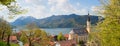 Idyllic spring landscape panorama, tourist resort Schliersee, with mountain view and beautiful church Royalty Free Stock Photo