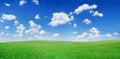 Idyllic view, green hills and blue sky with white clouds