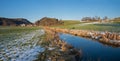 Idyllic stream valley at the end of winter