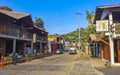 Idyllic street houses people cars hotels stores Mazunte Mexico Royalty Free Stock Photo