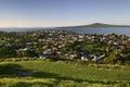 Hilltop vista of seaside suburb, scenic coast and Rangitoto Island from grassy Mount Victoria, Devonport, Auckland, New Zealand Royalty Free Stock Photo