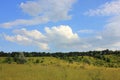 Idyllic summer landscape with green hills, trees, blue sky and clouds Royalty Free Stock Photo