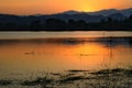 Dramatic sunset over the lake mountains and the sea with Fog of Kaeng Krachan Dam,Phetchaburi Province Thailand. Royalty Free Stock Photo