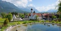 Idyllic tourist destination wallgau, little pond with ducks and Royalty Free Stock Photo