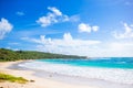 Idyllic tropical beach in Caribbean with white sand, turquoise ocean water and blue sky Royalty Free Stock Photo