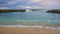 Idyllic tropical paradise with marine rocks, sea wave and sand. Beautiful beach Royalty Free Stock Photo