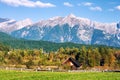 Idyllic tyrolean landscape with hills, forest, farm house and green fields Royalty Free Stock Photo