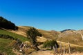 Idyllic view in autumn, on an old mountain road with an old fence and mountain peaks in the background. Bjelasnica Mountain, Royalty Free Stock Photo